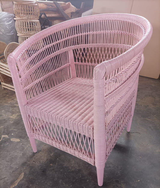Rattan armchair with velvet cushion in boho style