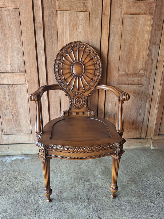 Rattan armchair with velvet cushion in boho style